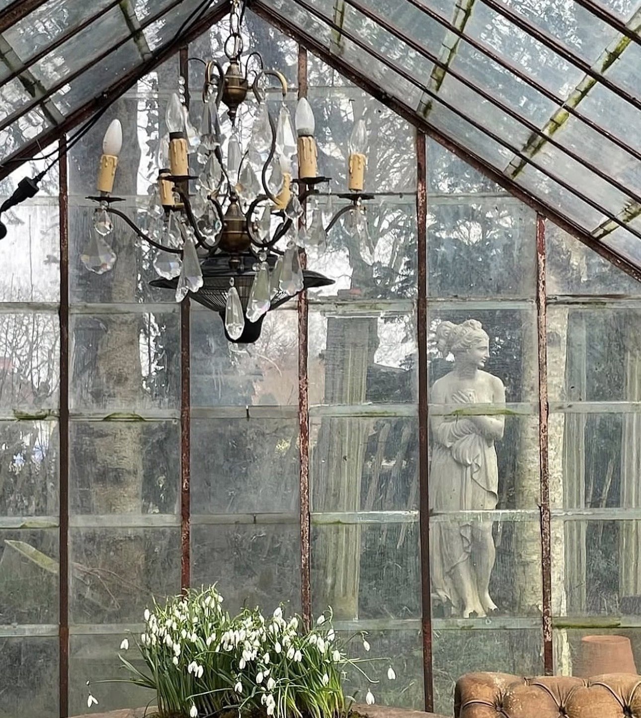 Glass conservatory with chandelier